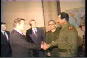 Donald Rumsfeld shakes hands with Saddam Hussein in 1983.