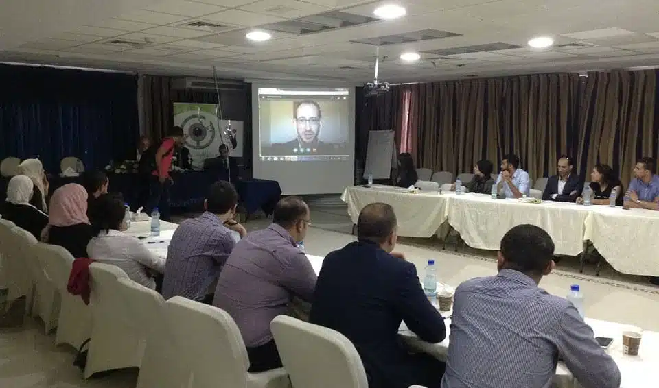 Jeremy R. Hammond speaks via Skype on the role of the US media in the Palestine conflict at the second of a series of conferences titled "100 Global Thinkers in Palestine". Ramallah, September 20, 2016. (Photo: Witness Center for Citizen Rights and Social Development)