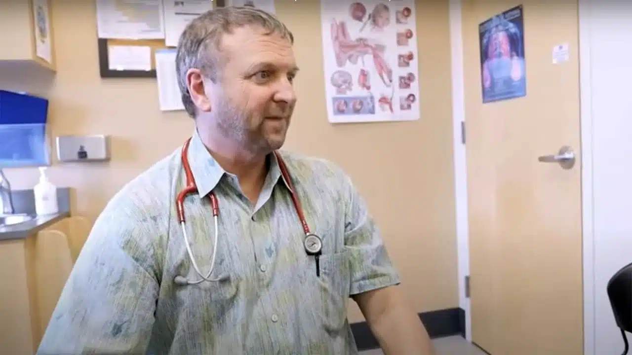 Dr. Paul Thomas with a patient in his clinic, Integrative Pediatrics image from "A Crazy Day in the LIfe of a Busy Pediatrician" on Dr. Paul's YouTube channel)