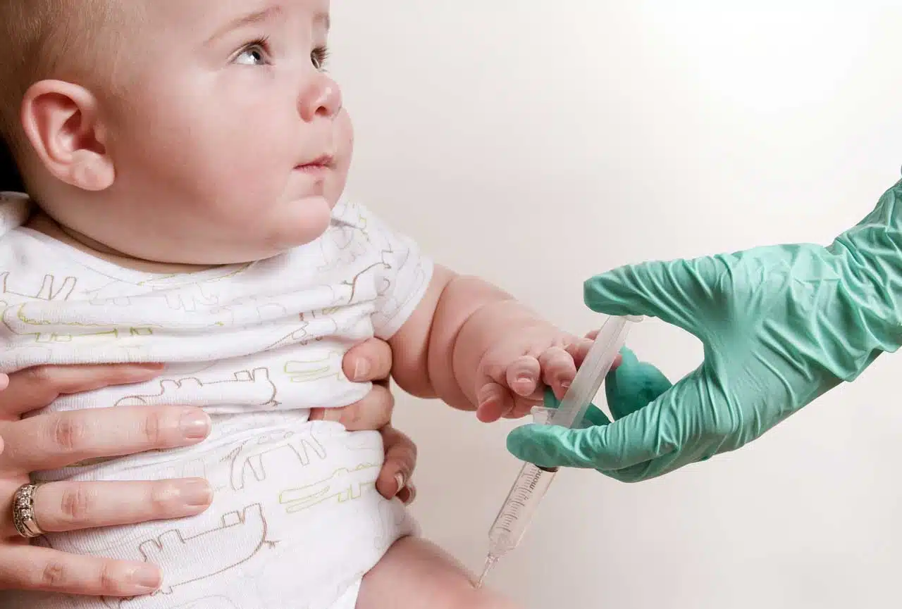 A baby receives an intramuscular vaccination in his right thigh (Public Domain photo by Amanda Mills, CDC, courtesy of Pixnio).